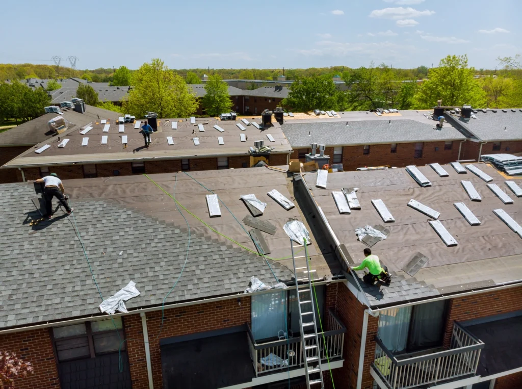 aerial view of roof underlayment exposed during roof replacement
