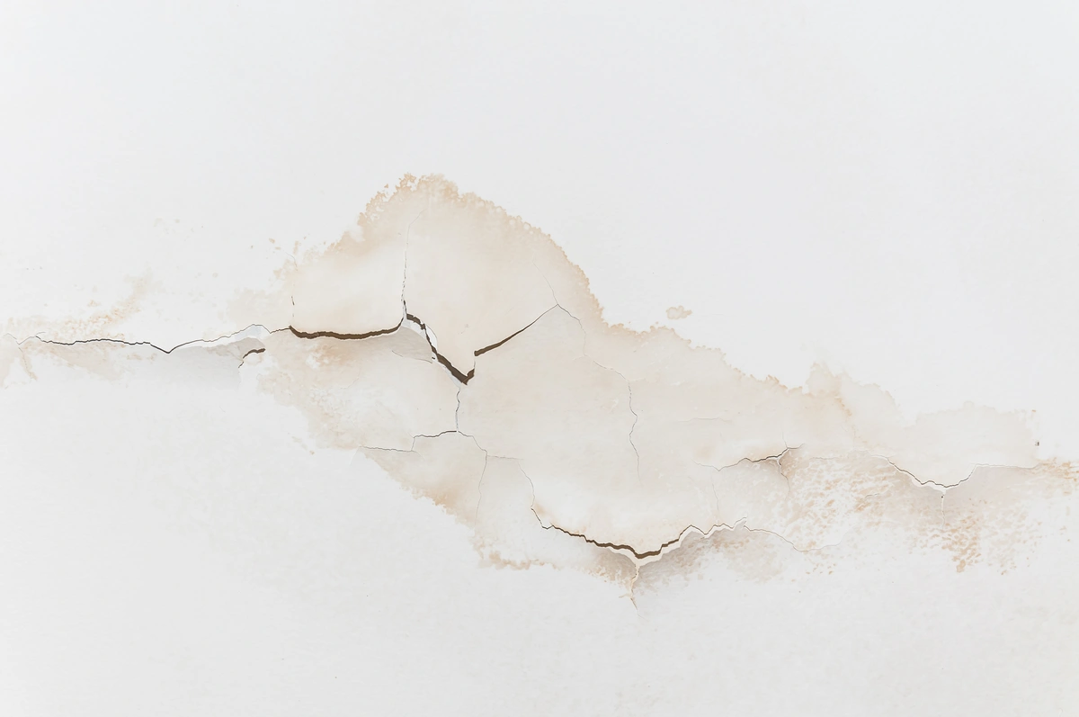 ceiling leak damaging ceiling and causing stains