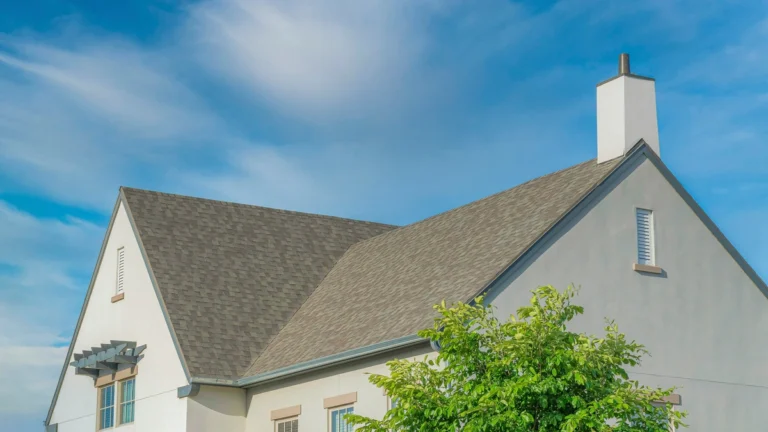 composite roofing on a home against a blue sky