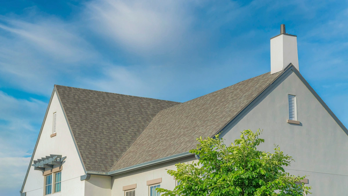 composite roofing on a home against a blue sky
