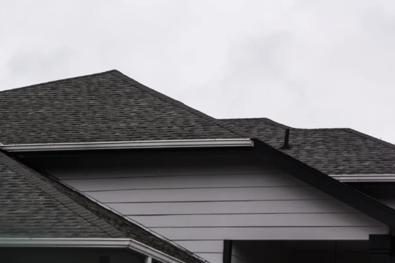 asphalt vs composite shingles-black composite roof shingles on a home