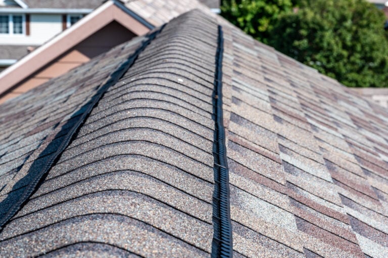 how to install ridge cap shingles-close up of ventilated ridge cap shingles on roof