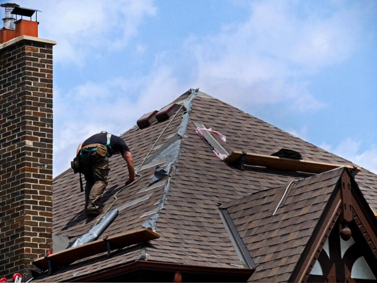asphalt roof repair-roof tech repairing sections of shingle roofing